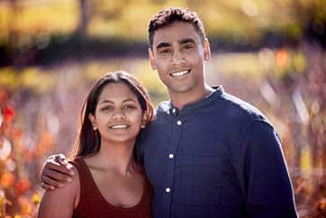 hopeful adoptive couple standing in a field in North Dakota